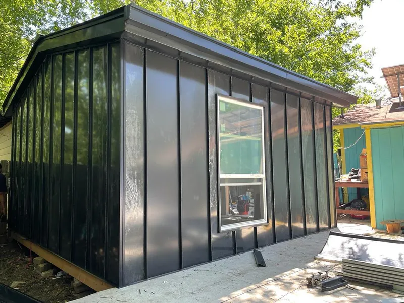 Black standing seam metal wall panels for Metal Roof Installation in Kingsland