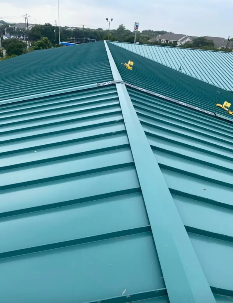 Green commercial metal roof ridge and valley for Metal Roof Repair in Kingsland
